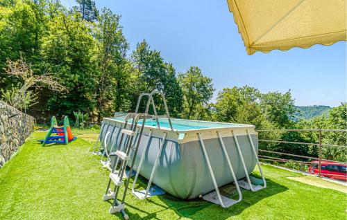 a small boat on the grass next to a playground at Casa Lià in San Biagio