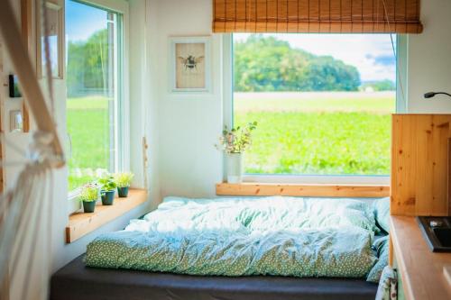 Ein Bett oder Betten in einem Zimmer der Unterkunft Time out in a tiny house