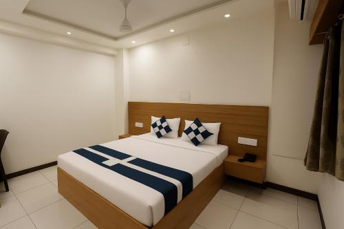 a bedroom with a large bed in a room at Hotel Dwarawati in Dwarka