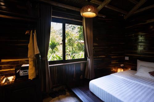 Postel nebo postele na pokoji v ubytování Trang An Ecolodge