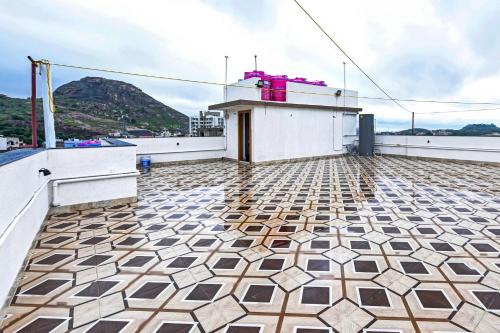 a balcony with a tiled floor on a ship at Collection O D N Grand in Rānchī