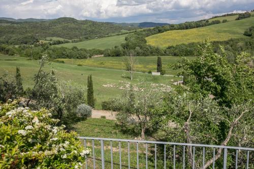 a view of a field from a fence at Spa Resort Fonte Alla Lepre in Riparbella