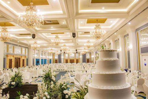 a wedding hall with a wedding cake in the middle at Lan Rung Beach Resort in Long Hai