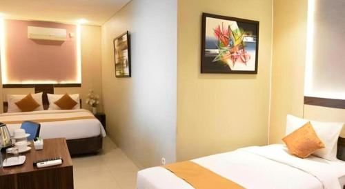 Ένα ή περισσότερα κρεβάτια σε δωμάτιο στο dPalma Hotel