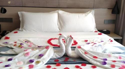 Cama o camas de una habitación en Shenzhen Hanyong Hotel Fuyong Branch