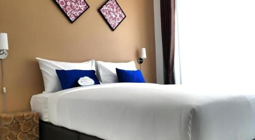 Ένα ή περισσότερα κρεβάτια σε δωμάτιο στο U Sleep Chiangmai