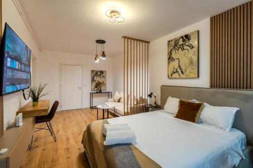 Ένα ή περισσότερα κρεβάτια σε δωμάτιο στο Blvd Ivory Pipera Ap 47