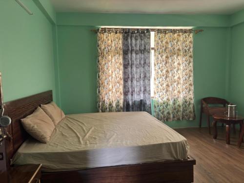 Ένα ή περισσότερα κρεβάτια σε δωμάτιο στο Kangri Homestay