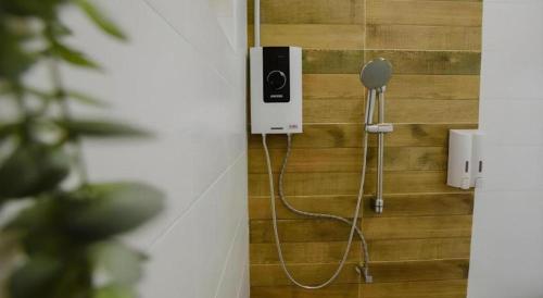 a wall with a blow dryer attached to a wall at Nornnadubua in Uthai Thani
