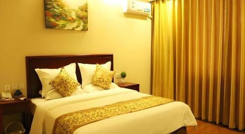 Ένα ή περισσότερα κρεβάτια σε δωμάτιο στο GreenTree Inn Hebei Zhangjiakou Xiahuayuan Xinchen Road Express Hotel