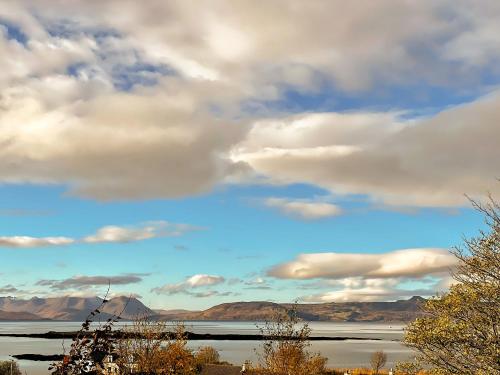 a view of a lake under a cloudy sky at Applecross Manse in Applecross