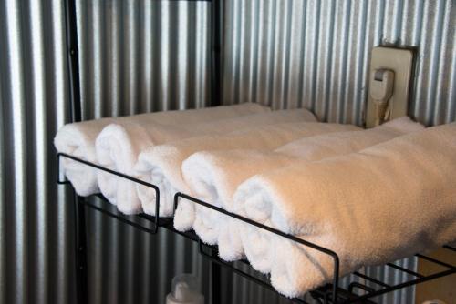 two beds in a cage with white blankets at Rockstar Villa 江井浜STYLE in Awaji