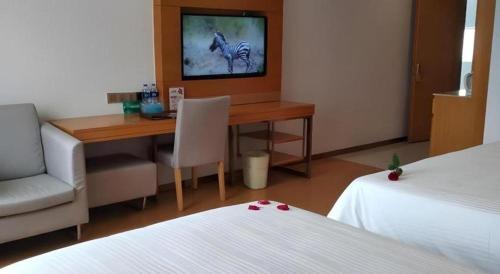Ένα ή περισσότερα κρεβάτια σε δωμάτιο στο GreenTree Inn Anqing Yuexixian Wenquan Branch