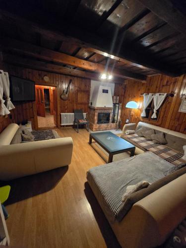 a living room with a couch and a table at Chalupa Liptovský dych in Svätý Kríž