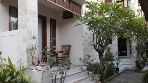 a house with plants on the front porch at Keke homestay sanur in Sanur