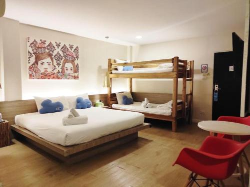 Postel nebo postele na pokoji v ubytování The Bed Hotel Hatyai