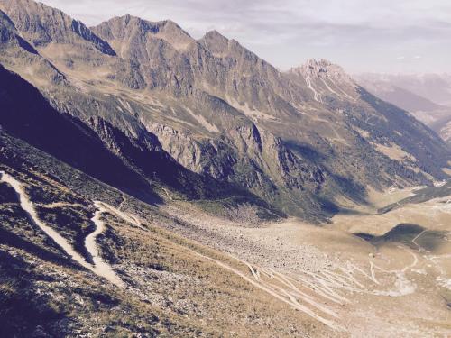 an aerial view of a mountain range with a river at Alpenhaus Monte in Neustift im Stubaital