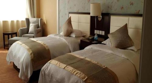 Ένα ή περισσότερα κρεβάτια σε δωμάτιο στο Inzone Garland Hotel Taian