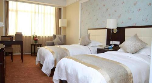 Ένα ή περισσότερα κρεβάτια σε δωμάτιο στο Inzone Garland Hotel Taian