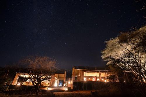 a building at night with a starry sky at Basecamp Samburu in Archers Post