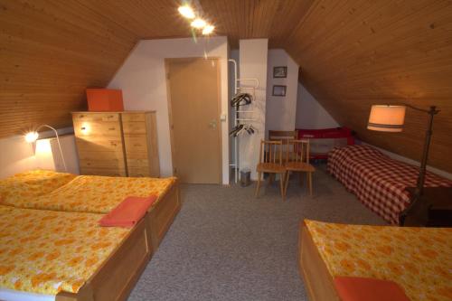 Postel nebo postele na pokoji v ubytování Orange House