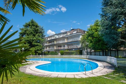 a swimming pool in front of a building at Casa Cristini in Marone