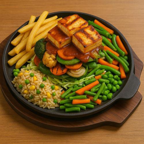 a pan of food with rice and vegetables and french fries at Hotel Elite rooms & Banquet in Prayagraj