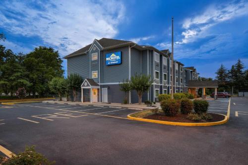 a building with a sign on the side of it at Microtel Inn and Suites - Salisbury in Salisbury