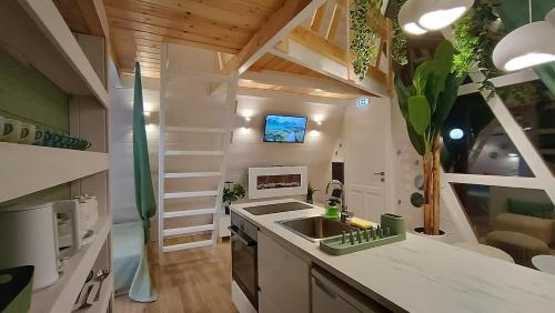 a small kitchen with a sink in a tiny house at White DIAMOND in Chalkidiki in Vergia