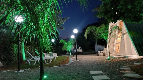 a park with benches and lights at night at White DIAMOND in Chalkidiki in Vergia