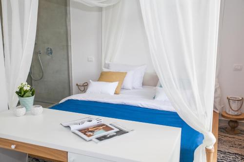 a bedroom with a bed with a curtain at Hotel Casa del Mare - Blanche in Herceg-Novi