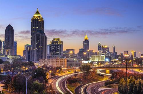 a view of a city at night with traffic at Hyatt Place Atlanta / Alpharetta / Windward Parkway in Alpharetta