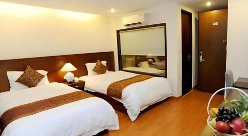 Кровать или кровати в номере CWD Hotel