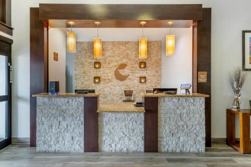 a lobby of a hotel with a reception counter at Comfort Inn & Suites Houston FM1960 - Champions in Houston