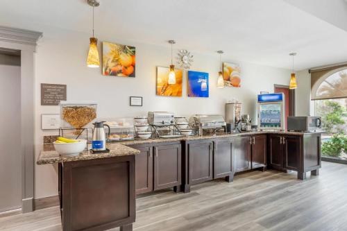 a kitchen with stainless steel counter tops and appliances at Comfort Inn & Suites Houston FM1960 - Champions in Houston