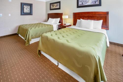 a hotel room with two beds in a room at Rodeway Inn Festival in Stratford