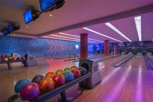 a bowling alley with bowling balls on the lanes at Signia by Hilton in Amman