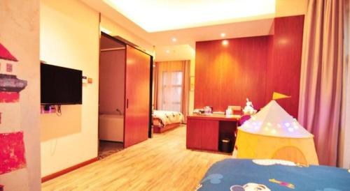 a room with a bedroom with a childs toy in it at Hangzhou Berman Hotel in Hangzhou