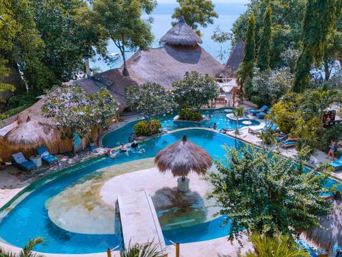 an overhead view of a pool at a resort at Hai Tide Beach Resort in Nusa Lembongan