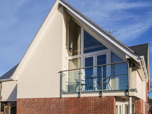 an extension to a house with a balcony at Sea Is All Around in Mundesley
