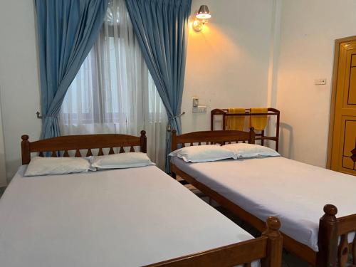 Postel nebo postele na pokoji v ubytování Eastern Holiday Resort and Restaurant