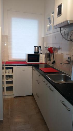 a kitchen with a sink and a counter top at Charming Apartment Beautiful View in Zagreb
