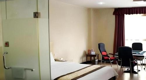Cama o camas de una habitación en Sheng Lin Na Hotel Minzhi Branch