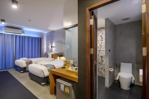 a hospital room with two beds and a toilet at B2 Krabi Premier Hotel in Ao Nang Beach