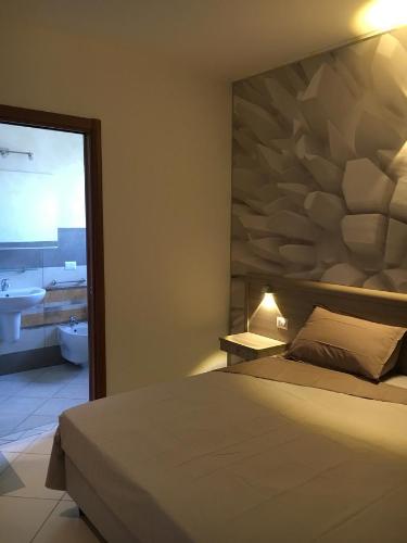Letto o letti in una camera di La Piazzetta Guest House