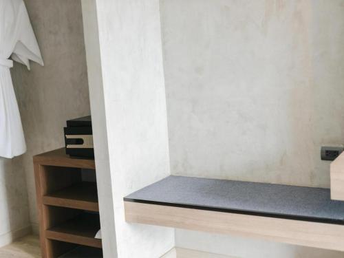 a room with a counter and a shelf in a room at B2 Krabi Premier Hotel in Ao Nang Beach