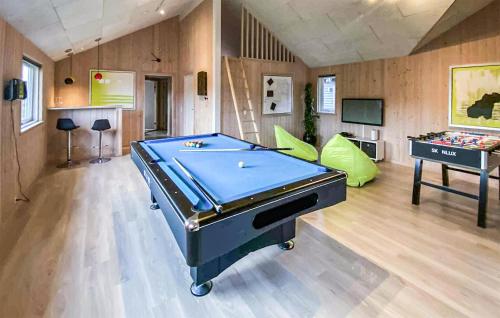 a ping pong table in a room with a pool table at Cozy Home In Nordborg With Sauna in Nordborg