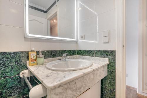 a bathroom with a sink and a mirror at Love Chill in Denia