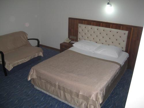 Ένα ή περισσότερα κρεβάτια σε δωμάτιο στο Miroglu Hotel