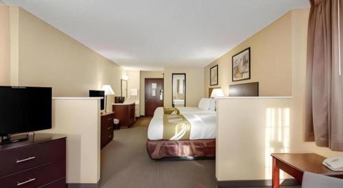 Ένα ή περισσότερα κρεβάτια σε δωμάτιο στο Quality Inn & Suites Lincoln North